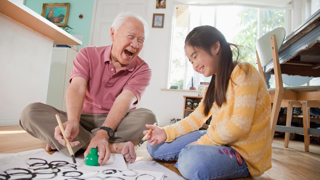 grandpa and granddaughter are writing;the image used for wealth retirement
