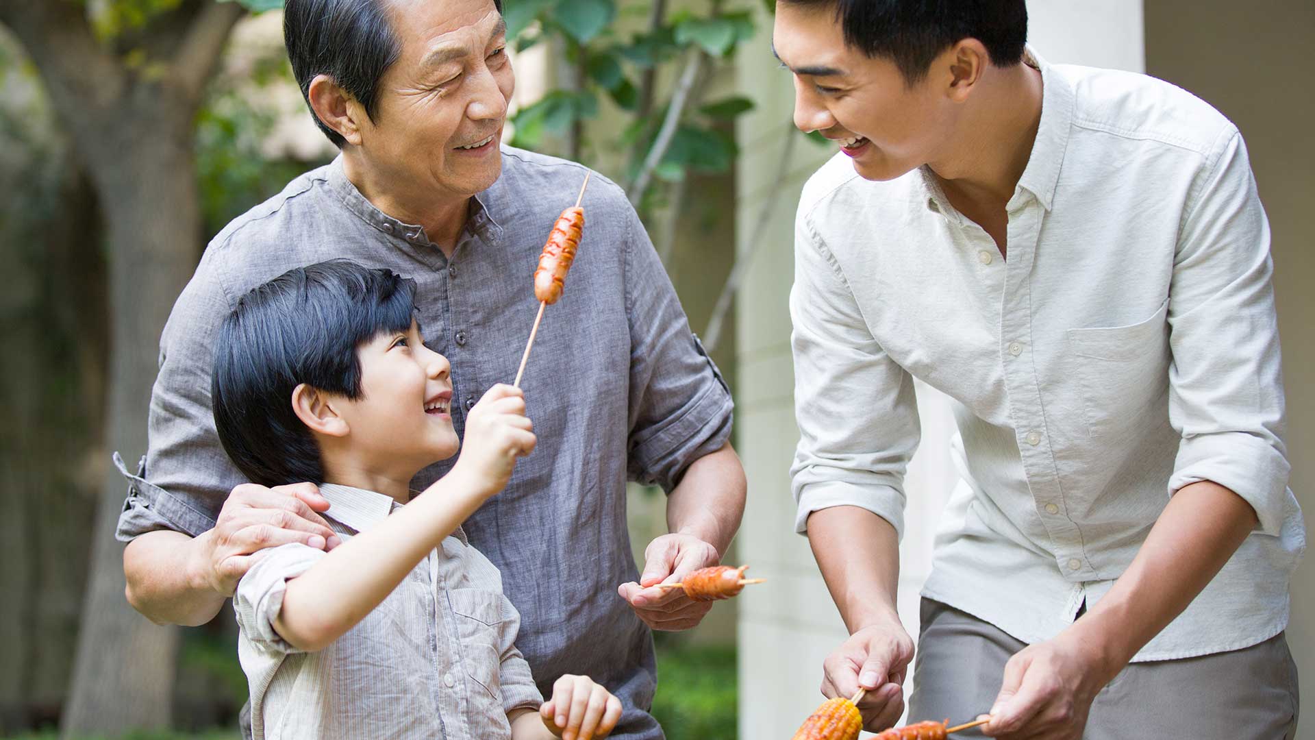Three generations of grandparents are barbecue ;  the image used for long-term financial management plan for your family