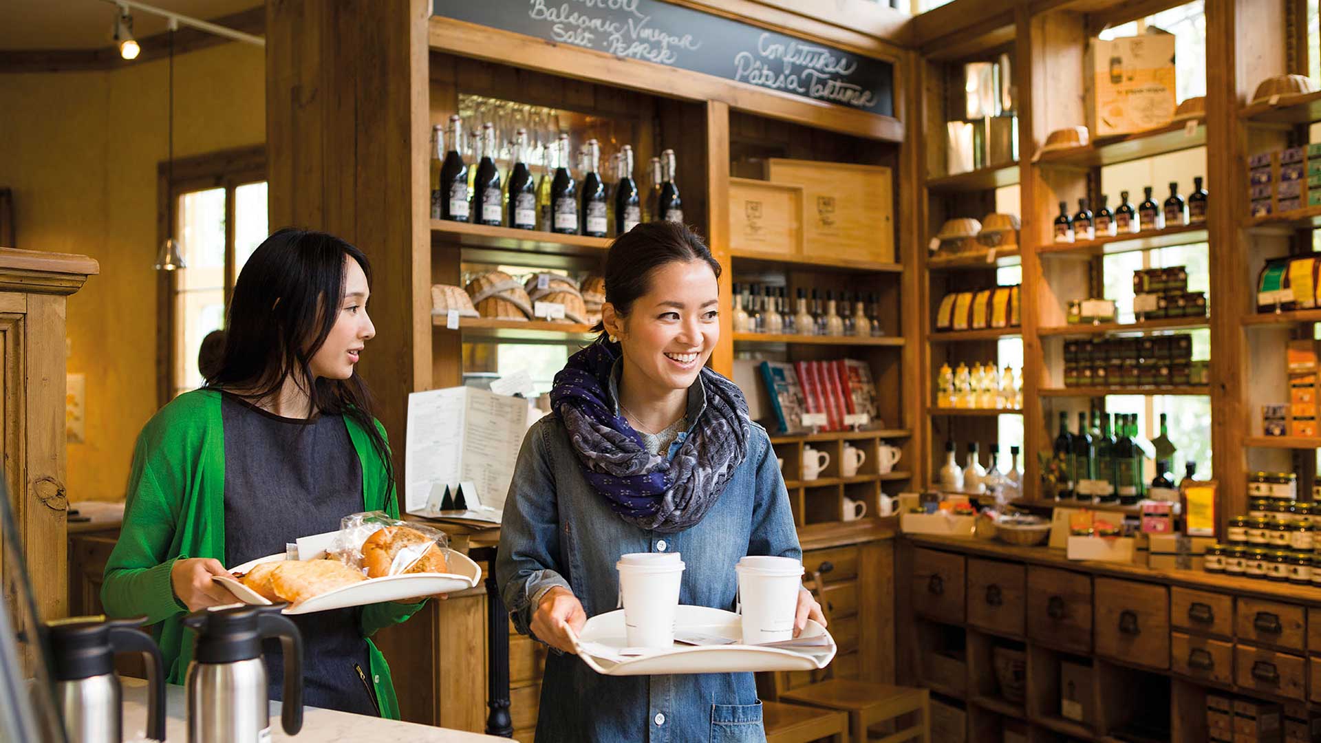 women holding trays