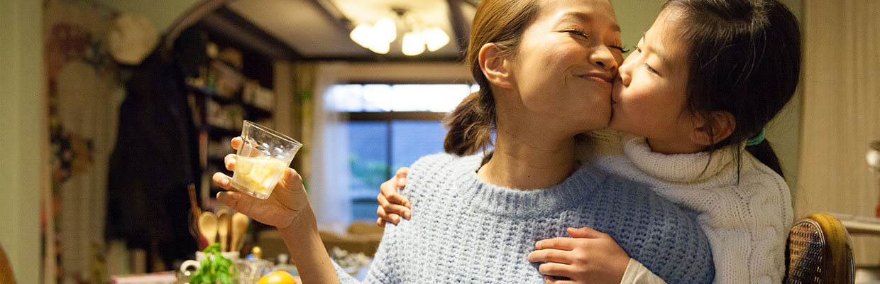 daughter is kissing mother; the image used for how will you look after your family