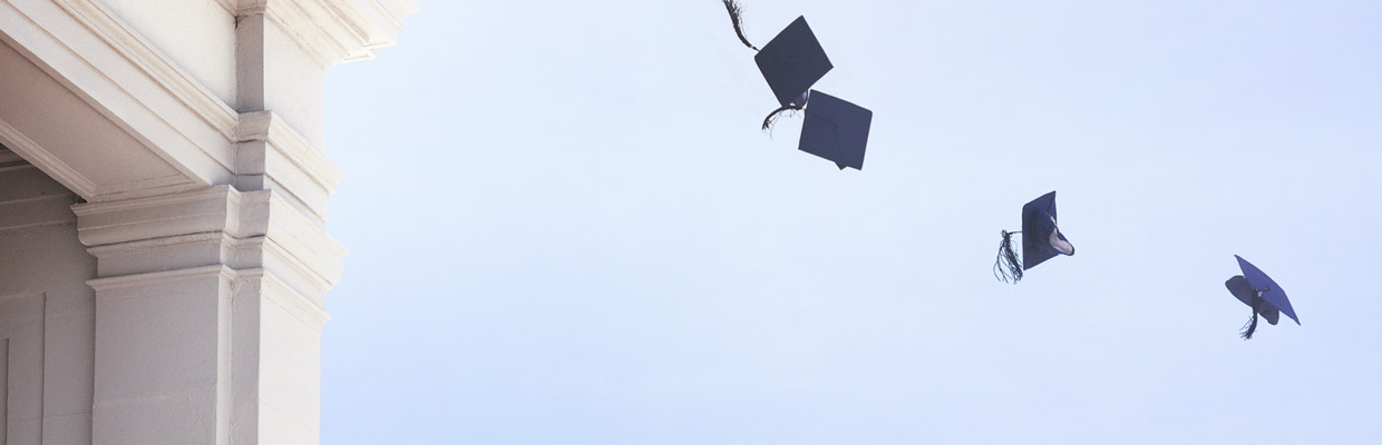 Dr. hats flying in the air; image used for HSBC International Education Forum