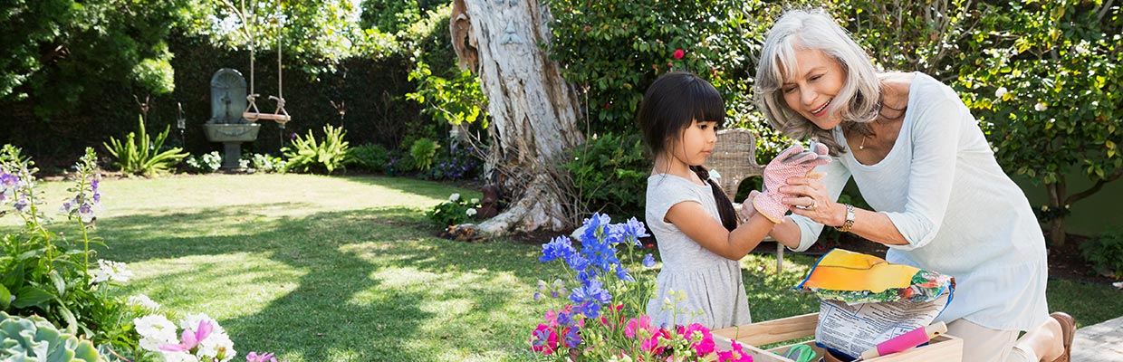 grandmother and granddaughter play in garden; the image used for 5 reasons you should start planning for retirement early
