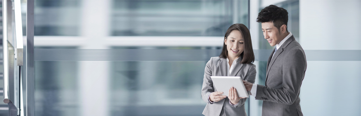 Colleagues watching tablet together; used for HSBC China Employee Banking Solution page