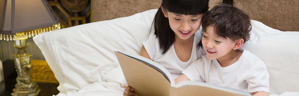 Sister and brother are reading books;the image used for wealth education