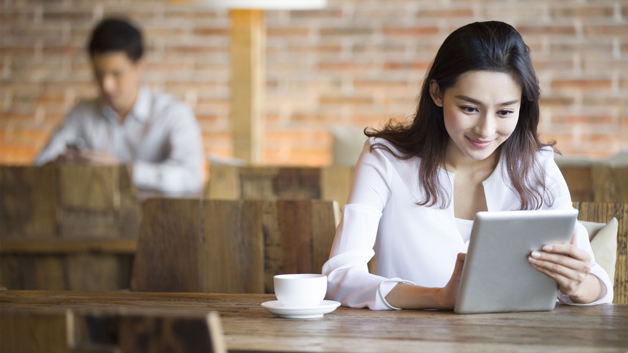 A female entrepreneur is using HSBCnet business banking services; image used for HSBC Fusion HSBCnet upgrade page.