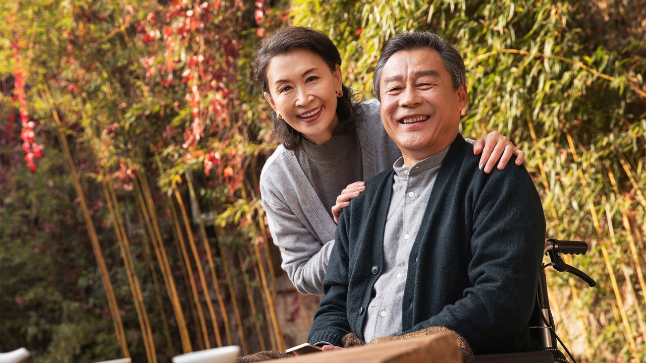 Elderly couple walking in the park; the image used for how to stay financially healthy