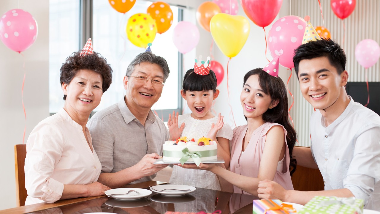 A family of three for the girl’s birthday; the image used for savings strategies for life