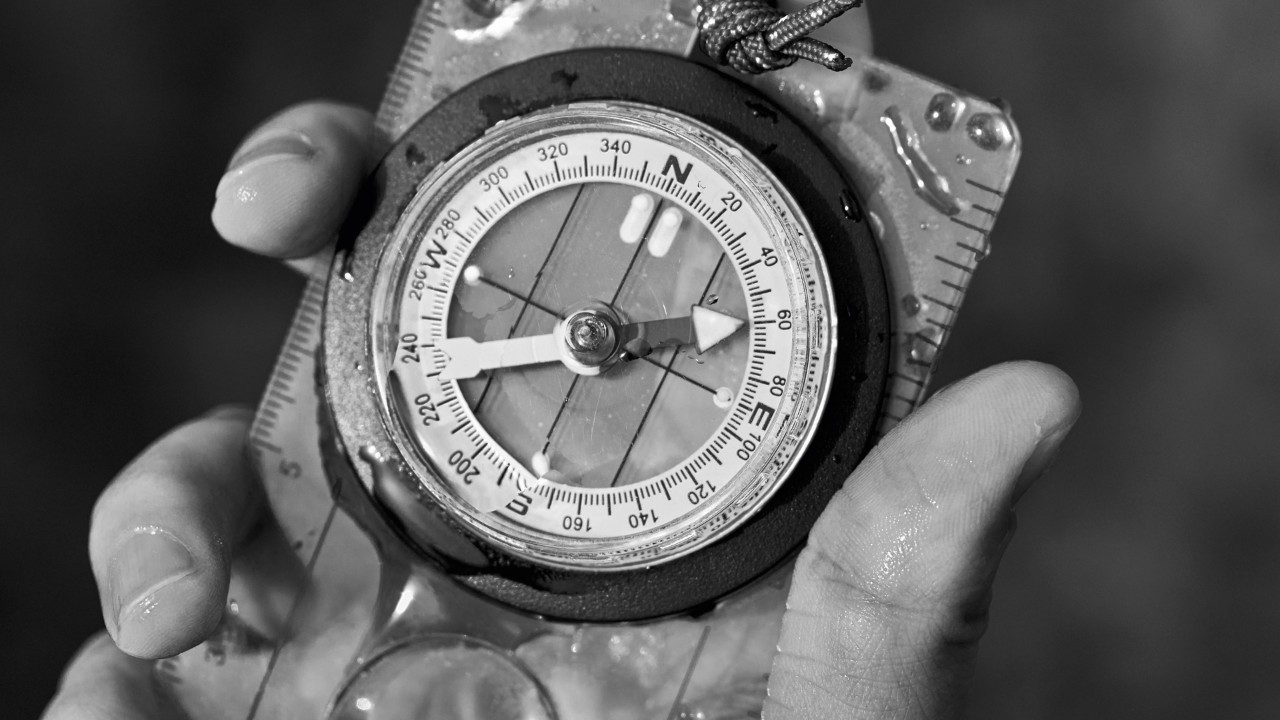Jade holding compass; image used for Customised wealth planning