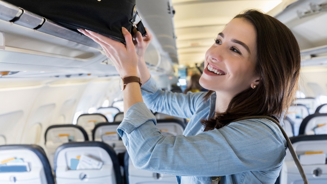 the lady storing luggage, the image used for Foreign currency solutions