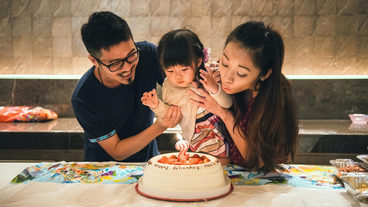 A family of three for the girl’s birthday; the image used for savings strategies for life