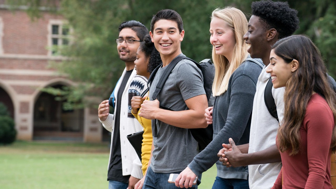 Students talking and laughing on campus