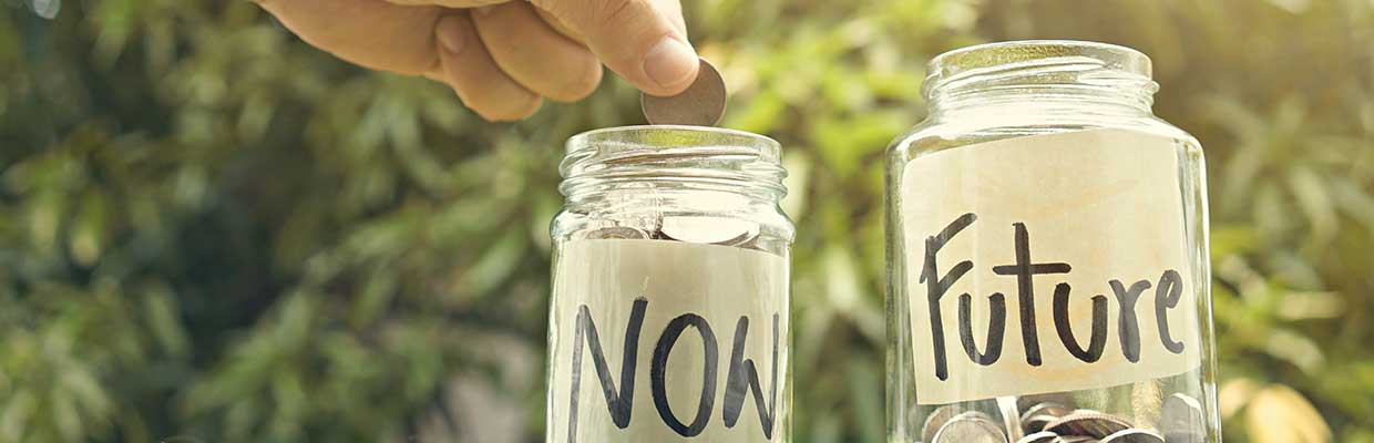 Put coins in the piggy bank; the image used for saving vs investing