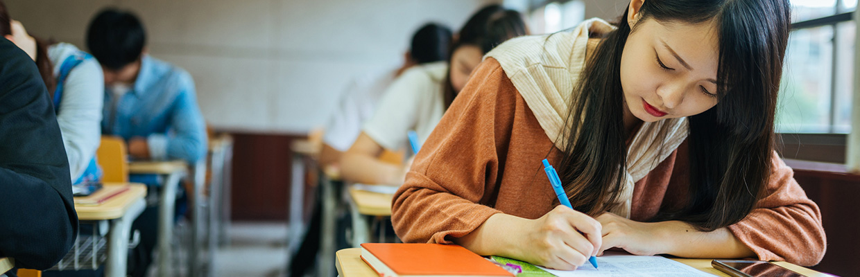 Students is studying in classroom;the image used for what does it cost to study abroad