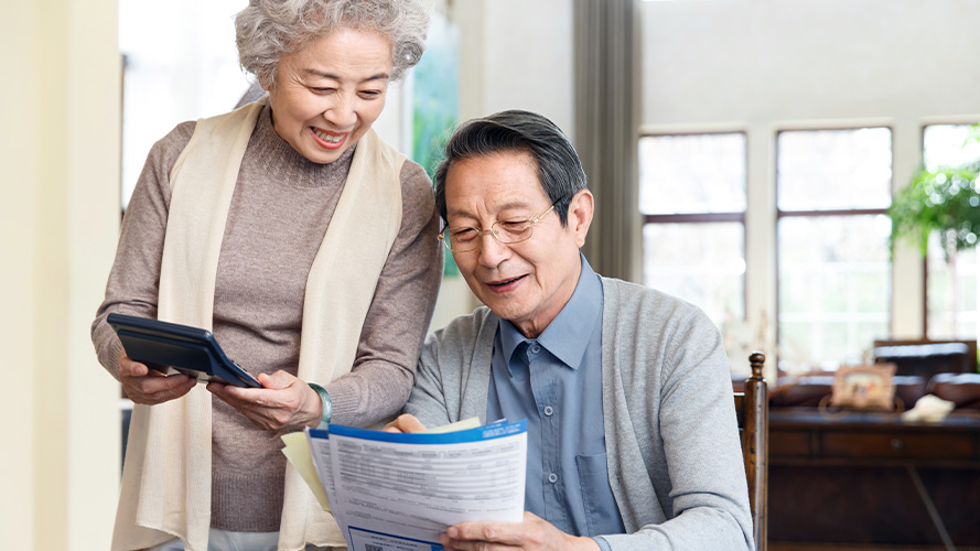 elder couple are searching information; the image used for long-term financial management plan for your family